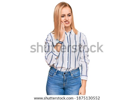 Beautiful caucasian woman wearing casual clothes touching mouth with hand with painful expression because of toothache or dental illness on teeth. dentist 
