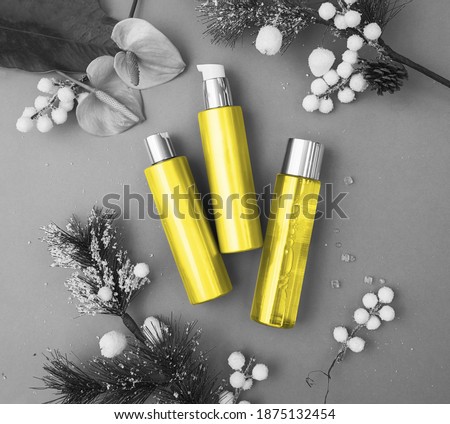 Colors of the year 2021: Ultimate Gray and Illuminating yellow concept. Makeup cosmetic products, flat lay, top view.