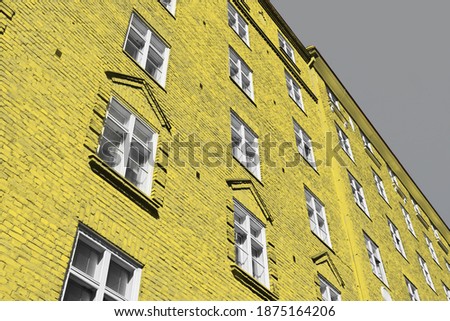 Bricks white windows building house in streets of Helsinki european city in Ultimate Gray and Illuminating colors. Good architecture composition in 2021 colors