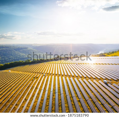 Top view on photovoltaic solar power panels. Alternative electricity source. Saving environment, save clean planet, ecology concept. Drone photography. Ukraine, Europe. Discover the beauty of earth.
