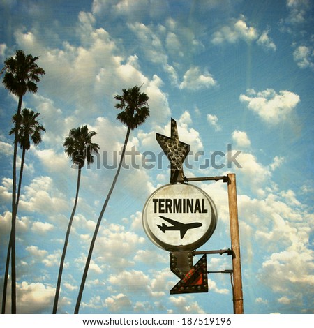  aged and worn vintage photo of  airport terminal sign with palm trees                            