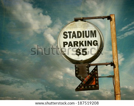  aged and worn vintage photo of stadium parking sign                              