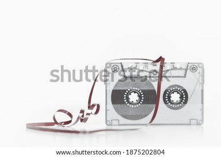Trendy reviving retro audio cassette tape monochrome isolated on white. Analogue music hipster trend