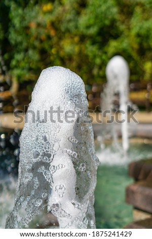 Sunny view of water sparkles of fountains in Nalchik, Kabardino-Balkaria, Russia
