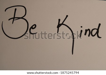 Be kind message written on white paper
