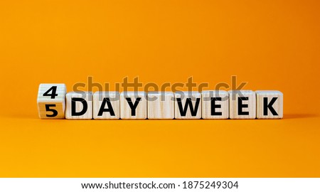 4 or 5 workday symbol. Turned the cube and changed words '5 day week' to '4 day week'. Beautiful orange background. Copy space. Business and 4 or 5 day week concept. Royalty-Free Stock Photo #1875249304