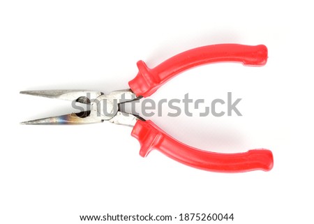 Metal platypuses with red plastic handles isolated on white