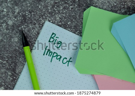 Big Impact write on a book on the table. Business concept. Selective focus on Big Impact Text