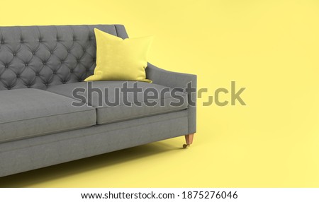 Modern scandinavian classic gray sofa with yellow, gray pillow on wooden legs on yellow background. Pantone color of year 2021. Illuminating and Ultimate gray. Furniture, interior object, Fabric sofa 