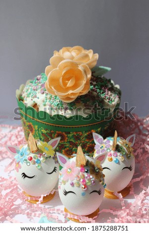 Easter background with flowers cake and unicorn eggs for celebration. Happy Easter.  Easter food wallpaper.