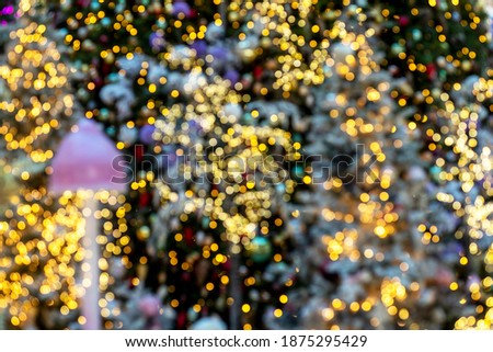 Background with blurred warm glowing Christmas lights and decoration