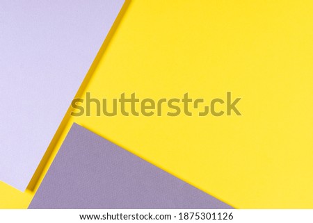Abstract geometric paper background in yellow and gray colors. Top view