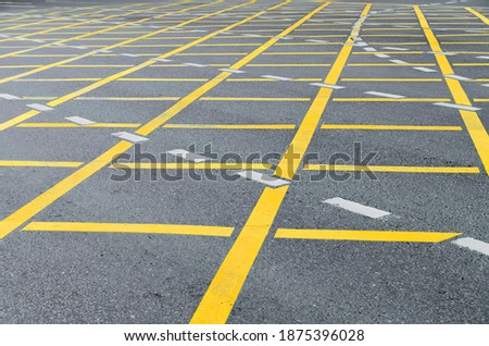 Yellow road road marking on grey asphalt