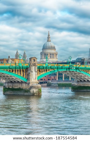 Southwark Bridge and st. Paul's Cathedral on the background on a cloudy morning