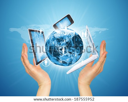 Hands holding a earth and electronics. Concept of communication. Elements of this image are furnished by NASA