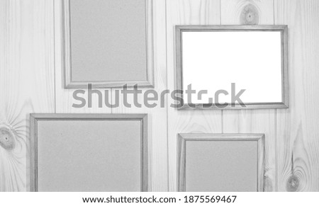 Mock up empty wood frames on light pine wood wall background, show text or product.