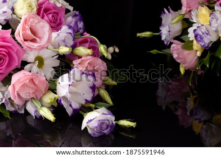 two bouquet compositions of flowers from roses, lisianthus, chrysanthemum on a black background with reflection.