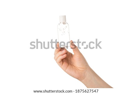 Cropped closeup view photo of female hand showing holding small little transparent bottle with antibacterial liquid isolated white background Royalty-Free Stock Photo #1875627547