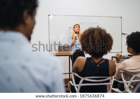 business woman explaining plan of work in conference.
