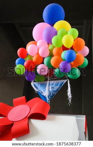 Colored balloons in the sign on the opening party box