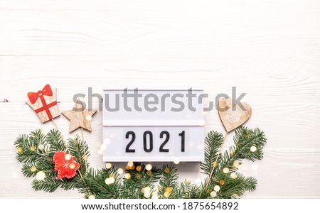 New Year or Christmas layout with numbers 2021. Lightbox with symbols the year