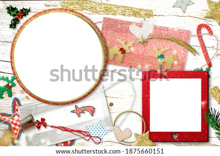 Christmas two empty photo frames greeting card pandemic time. Two empty photo frames, 2 customize face mask for coronavirus protect, xmas ornaments, needle and thimble, craft concept.