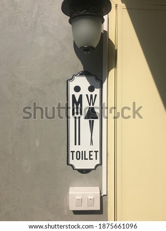 Male female toilet sign in a coffee shop