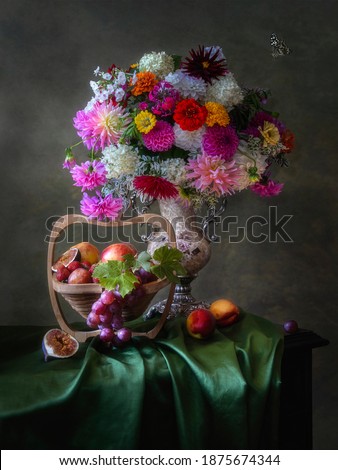Still life with luxurious bouquet of flowers and fruits