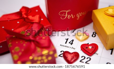 Top view colorful boxes gifts ribbon presents, greeting event holiday, bright white calendar 14 February. Concept for lover Valentine's Day inscription For You. Love symbol heart shape design