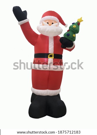 A doll in a Santa Claus costume Holding a christmas tree To give happiness on Christmas day On a white background.