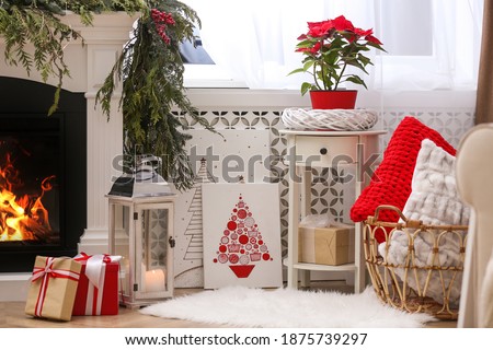 Beautiful pictures of Christmas tree on floor in decorated room. Interior design