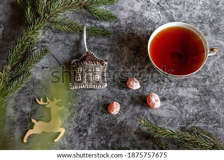 New Year's photo of cha on the table, dried kumquat, fir branches and toys, postcard