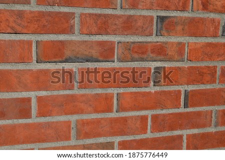 Brown and dirty Brick wall geometric mosiac tiles construction background texture