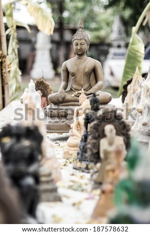 old Buddha statues in Thailand ,with songkran festival