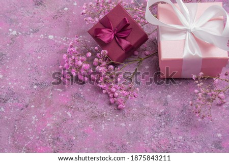 Two gift boxes and a gypsophile. Greeting card for Valentine's Day, anniversary, Mother's Day and birthday greetings, has a copy of the space