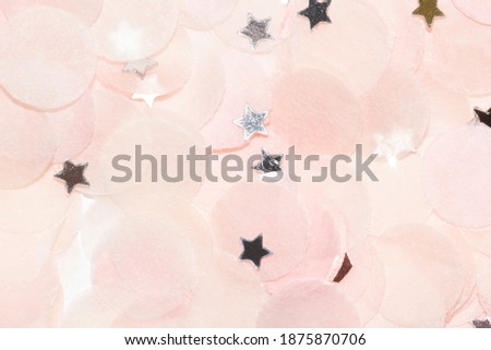 colorful paper confetti with silver star confetti close up macro for your project