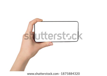 Taking picture concept. Pov first person view photo of female hand holding telephone in horizontal position taking image isolated white background
