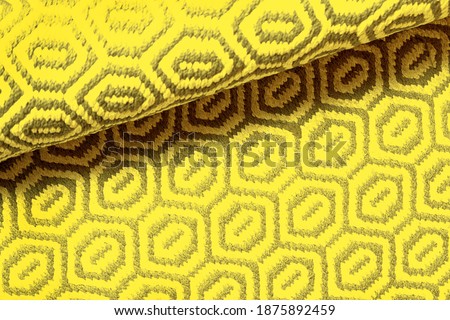 Bright IlluminatingYellow and Gray Wool Rug Carpet Texture Background. Concept of Color of the Year 2021 with bright illuminating yellow and gray colours. Top view, flat lay, copy space.