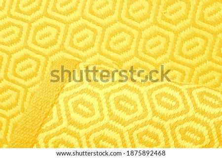 Bright IlluminatingYellow and Gray Wool Rug Carpet Texture Background. Concept of Color of the Year 2021 with bright illuminating yellow and gray colours. Top view, flat lay, copy space.
