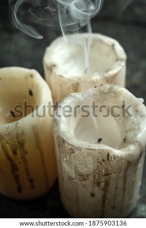 Ritual candles on wooden background