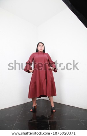 Plus size European woman wear stylish dress on white background in studio. Luxury designer collection. Fashion trend concept. Boutique selling clothes. Summer fashionable wardrobe for overweight 