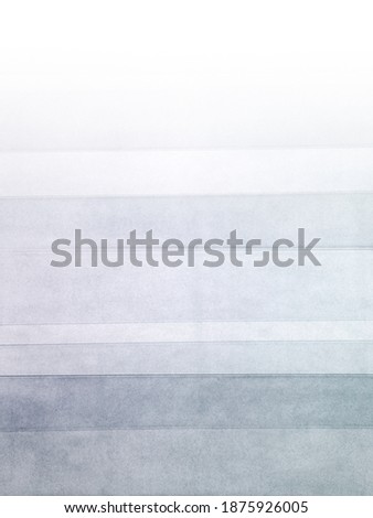 Grey white layered translucent plastic strips create abstract background