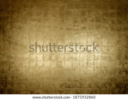 Luxurious burnished gold leaf surface on background panel Royalty-Free Stock Photo #1875932860