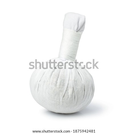 Herbal compress ball for massage and spa isolated on white background with clipping path.  Royalty-Free Stock Photo #1875942481