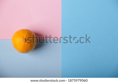 lemon on a pink and blue background