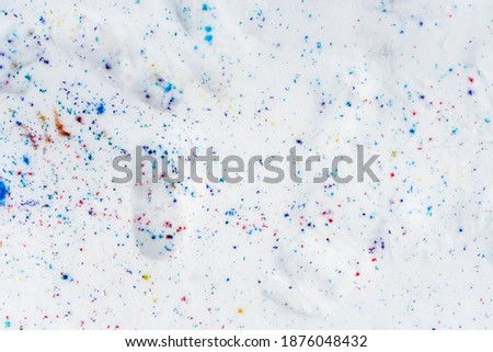 Winter snow. Paint splashes on the snow. Texture Top view of the snow. Background