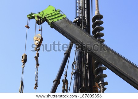 Heavy construction equipment against blue sky 