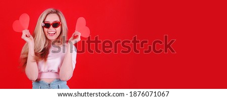 Woman with red heart in hands. Valentine`s Day. 