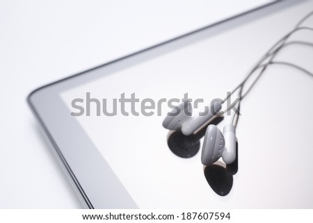 Tablet with earphones