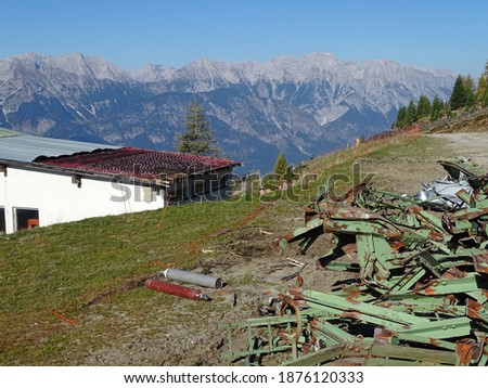                                old dismantled skiing station with destroyed iron construction and cable transport rollers